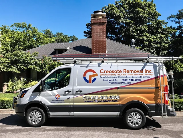Uxbridge Chimney Sweep technician removing creosote safely in Uxbridge, MA