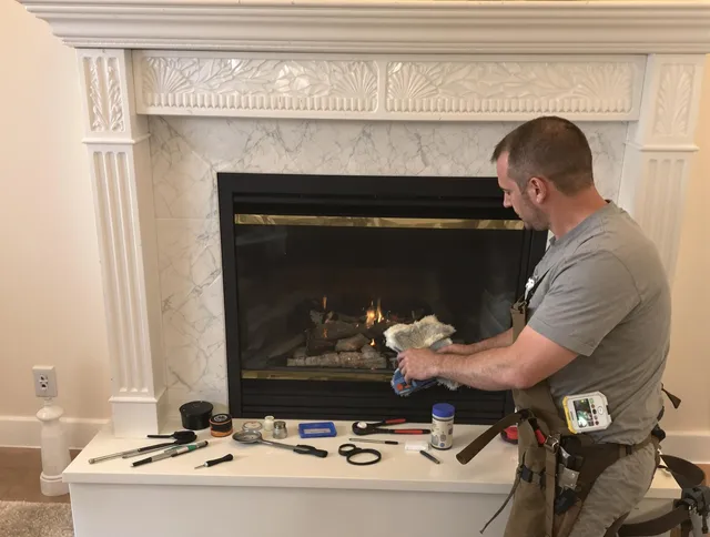 Uxbridge Chimney Sweep performing fireplace maintenance in Uxbridge, MA